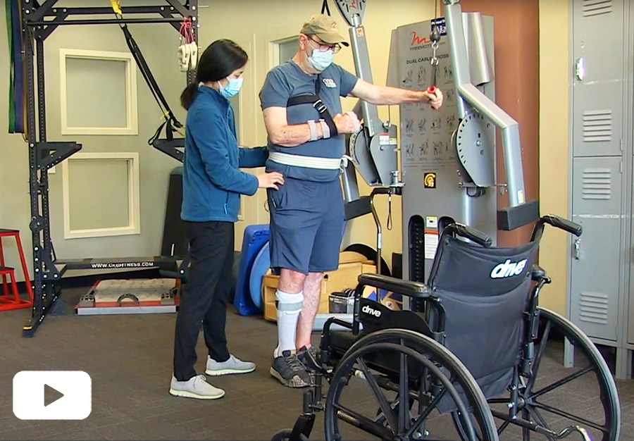Physical therapist Lori Ginoza works with patient William Mallon