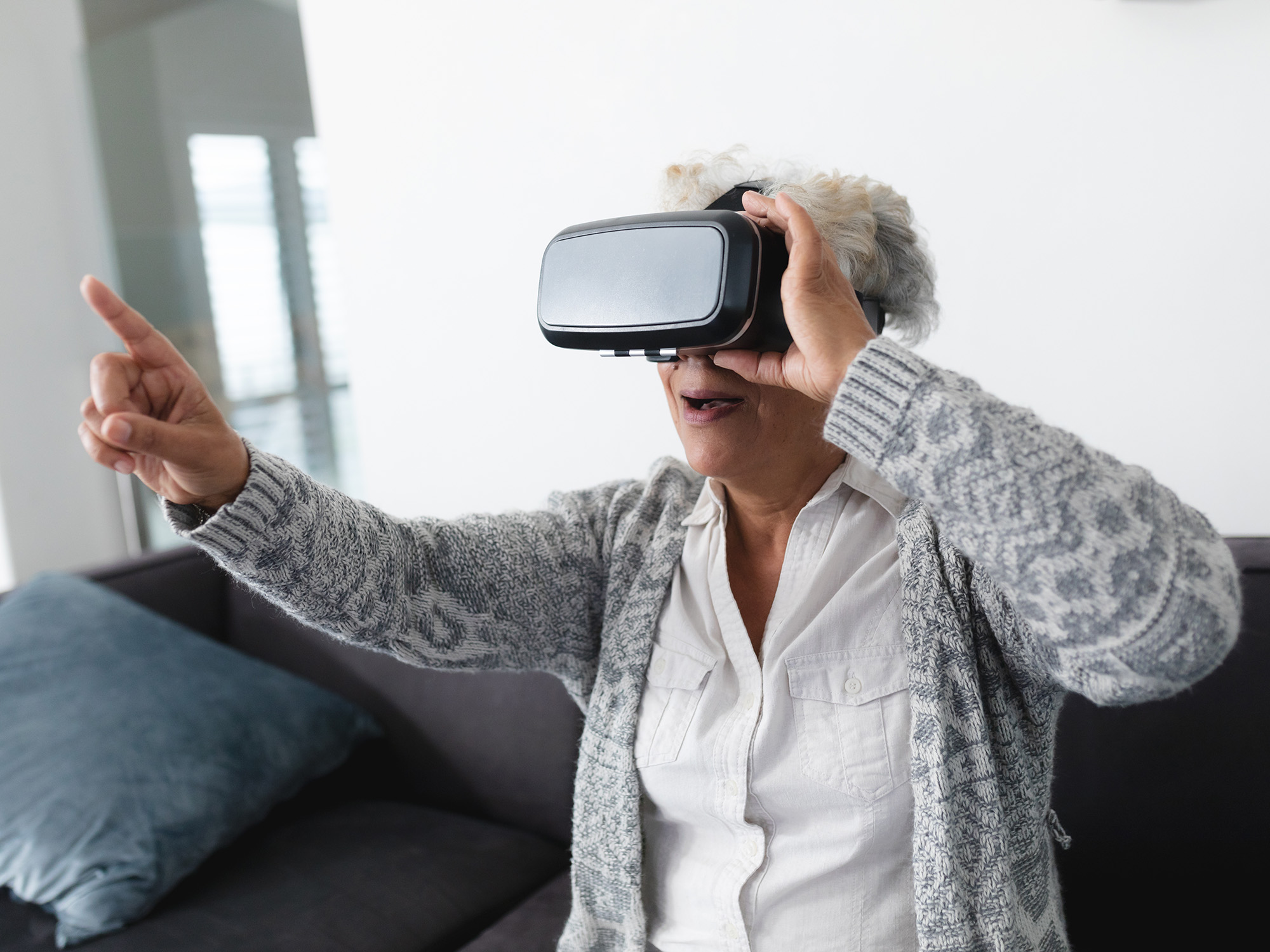 Older woman wearing virtual reality headset